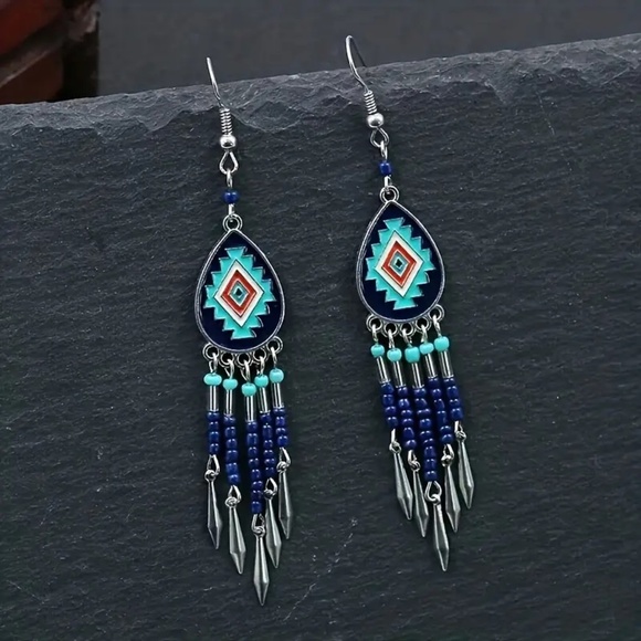 Jewelry - NWT  Bohemian oval hand-woven rice beads tassel earrings with a touch of…